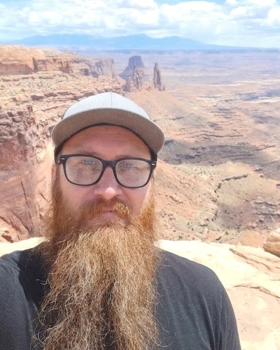 Joe White, Business Development at Kudurru Stone, at a canyon overlook in the Utah desert.